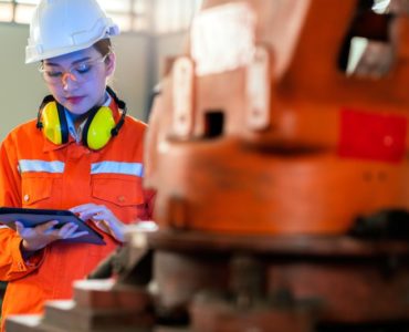 A construction worker wearing an IoT helmet